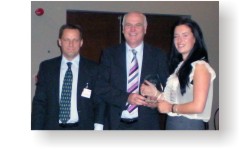 Philippa Cockburn receiving her award from Andy Topley and Clive Waddington