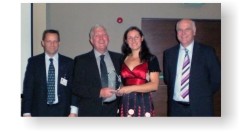 Jessika Shakarian and Brian Marshall receiving their award from Andy Topley and Clive Waddington