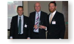 Ben Johnson receiving his award from Andy Topley and Clive Waddington