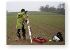 A total station being used to set out a grid in preparation for a magnetomical survey