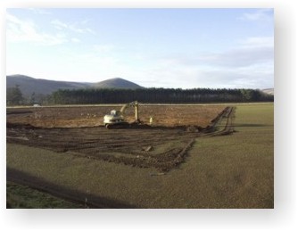 A view across Lanton Quarry towards the Cheviot Hills