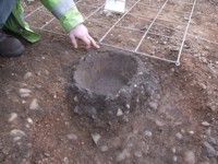 A Later Neolithic cremation vessel during excavation