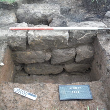 Late 18th to 19th century double-skinned sandstone wall in Trench 2 (scale = 1m).