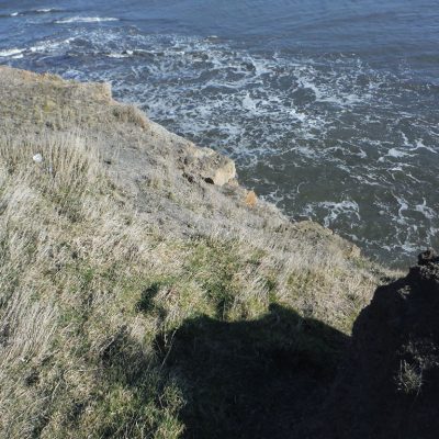 Structural remains eroding from the cliff at Sandsend. © Copyright ARS Ltd 2018