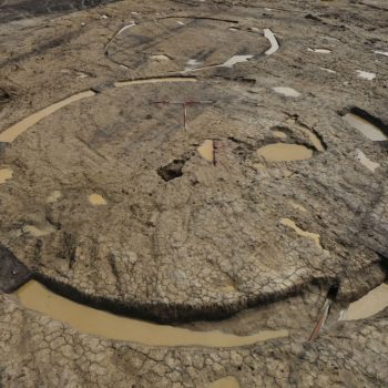An Iron Age roundhouse with an associated enclosure taken during an excavation using our high-level photography equipment. © Copyright ARS Ltd 2018