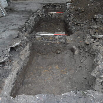 Trench 5 showing wall foundations (scales = 1m).