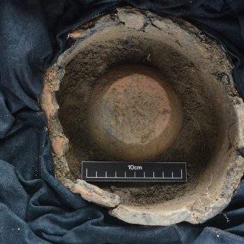 The large urn was found to contain a smaller, collared urn within (scale = 10cm).