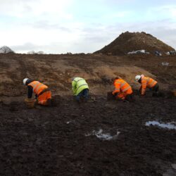 The team beginning the removal of the Mesolithic soil within the kettle hole. © Copyright ARS Ltd