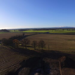 A drone photograph looking over the kettle hole westwards towards the A1 trunk road. © Copyright ARS Ltd