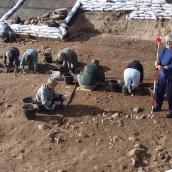 Volunteers excavating a Mesolithic hut scoop at Low Hauxley. © Copyright ARS Ltd 2020