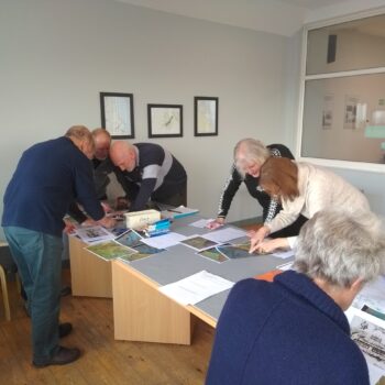 Volunteers analysing aerial photography as part of their course© Copyright ARS Ltd