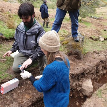 Specialists from the University of Tromsø Museum taking samples from the fill of one of the terraces.