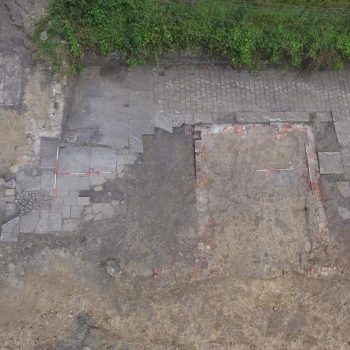 An aerial view of the cobbled driveway leading in to the property.