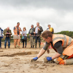 A member of our team excavating as visitors from the open day look on. © Copyright Sam Devito