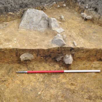 The stone-ringed hearth pit containing burnt material which was discovered during excavations in 2018.