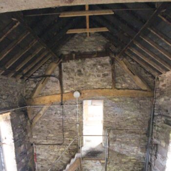 Northern section of Barn B’s northern wall, showing entrance to loft and threshing floor, taken from first floor, facing north. Scale 2m. © Copyright ARS Ltd 2021.