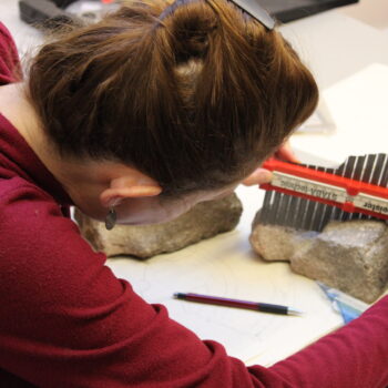 Measuring the profile of a quern stone for illustration © Copyright ARS Ltd 2023