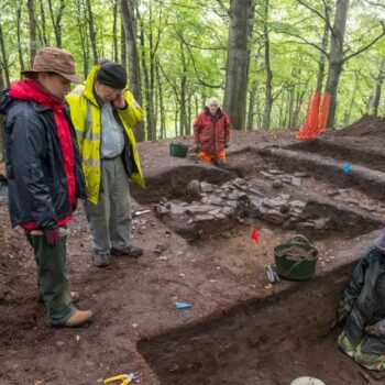 Archaeologists David Anderson and Dr Gemma Cruickshanks and volunteers in 2018 working in the metal-working area of Trench 1 © Michael Sharpe 2022