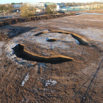 Ring ditch with Leisure Centre in background looking west © Copyright ARS Ltd 2023