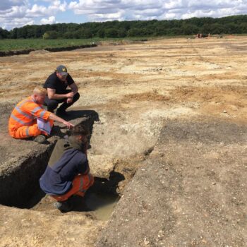 Archaeologists pondering a section © Copyright ARS Ltd 2023
