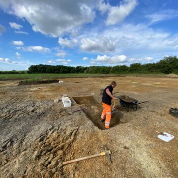 Digging the feature where the whey strainer was discovered © Archaeological Research Services Ltd 2023