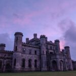 In this week’s #BuildingKnowledge we are back with another sham castle, but this time on a much larger and grander scale. The remarkable Grade II* Listed Lowther Castle, Cumbria, had been built by Sir Robert Smirke for the 1st Earl of Lonsdale between 1806 and 1814, on the site of an earlier medieval hall. This fascinating sandstone faux castle has been built in the Gothic style, with pointed arches with stone tracery and soaring battlemented towers, but is wholly symmetrical in its design, making it distinctly of 19th century character. The building had been constructed with 260 rooms at a cost of £77,000. Lowther Castle was closed in 1935 and subsequently used as a tanking range during the Second World War. Today the building stands as an extraordinary ruin, with the roof removed in 1957. © ARS Ltd 2021