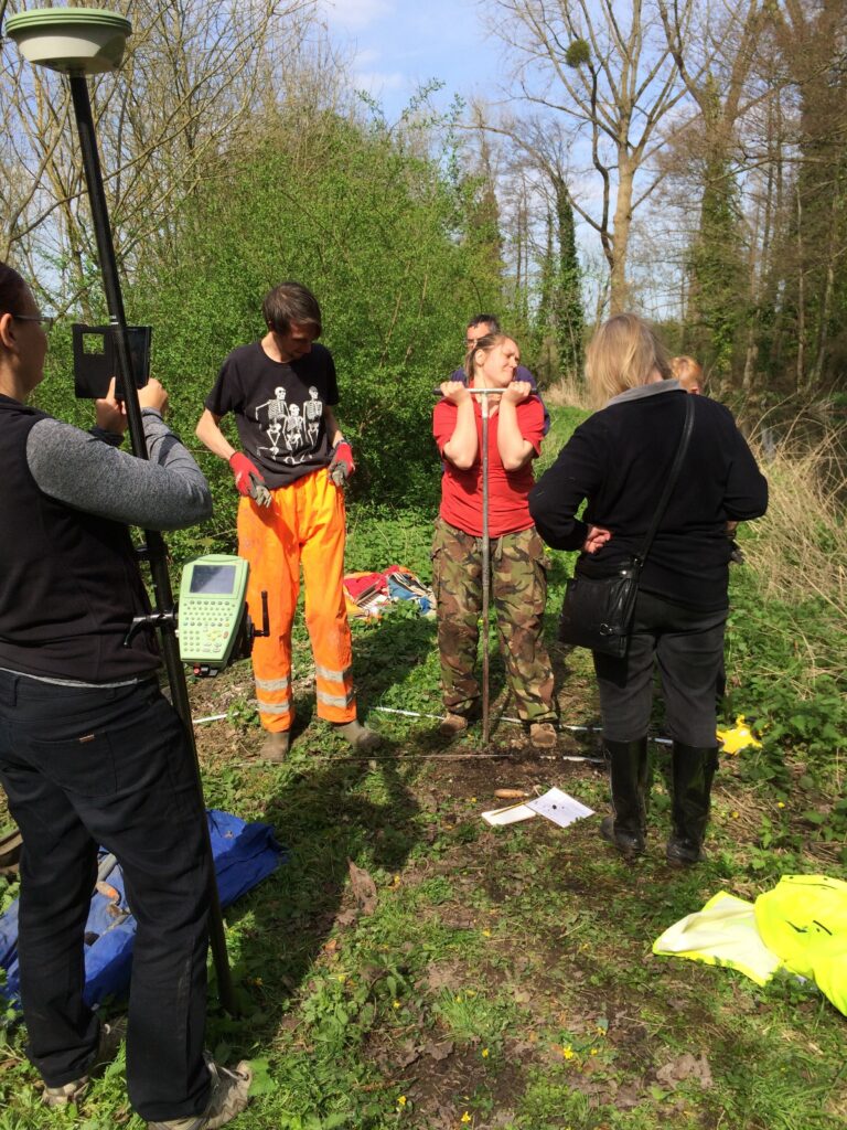 Project members assist archaeologists from the University of Winchester in an auger survey of the retaining bank of the Fishlake near its source on the Test © ARS Ltd 2023