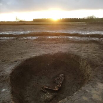 Primary inhumation burial at sunrise © ARS Ltd 2023