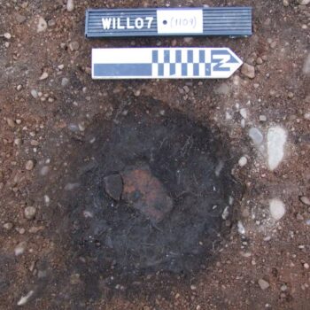 Pottery sherd in smaller possible cremation pit © ARS Ltd 2024