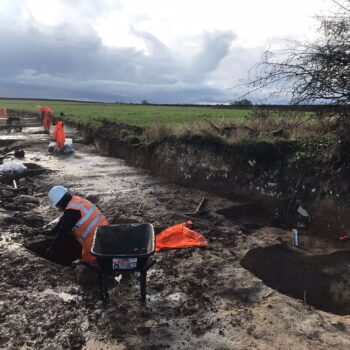 Working shot, part of the Late Iron Age to Roman horseshoe-shaped enclosure under excavation © ARS Ltd 2024