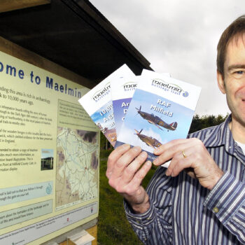 Co-founder Peter Forrester holding up the site leaflets he designed